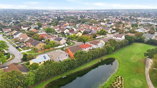 an aerial view of city and lake