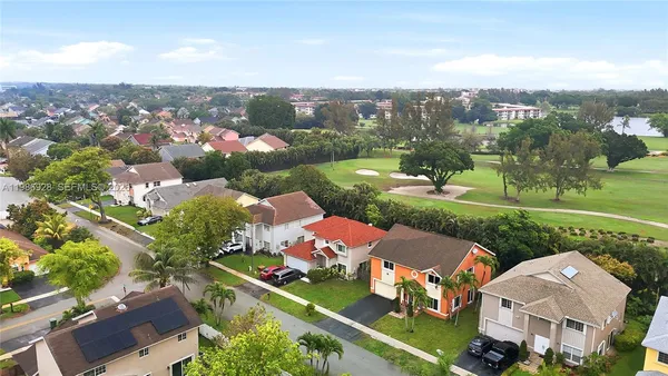 an aerial view of a house with a garden