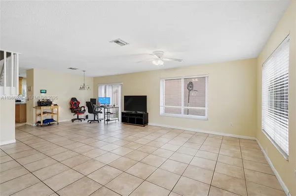 a view of a livingroom with furniture and a window