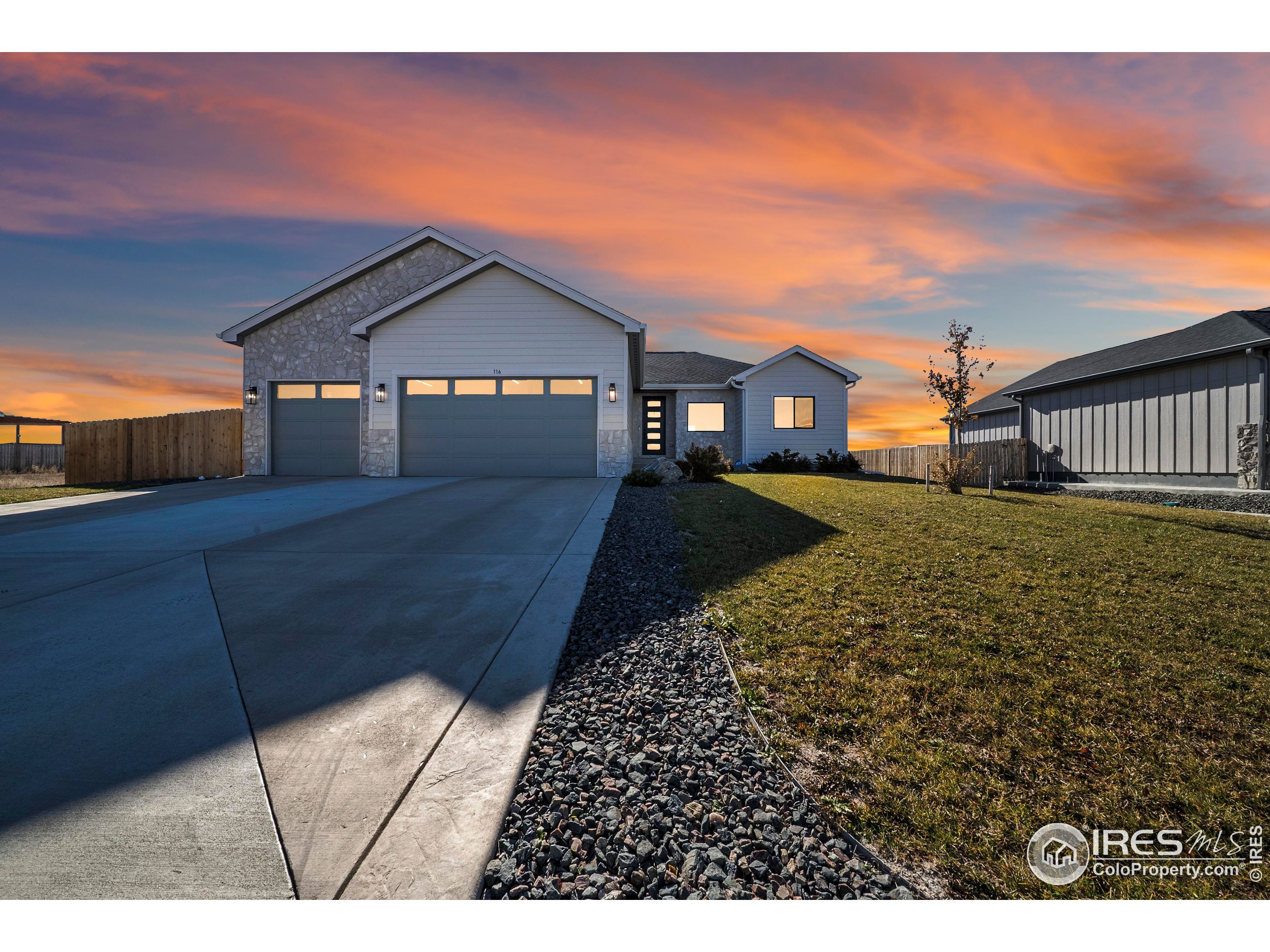 116 7th Avenue Wiggins, CO 80654 - Photo 2 of 42 a view of a house with a yard