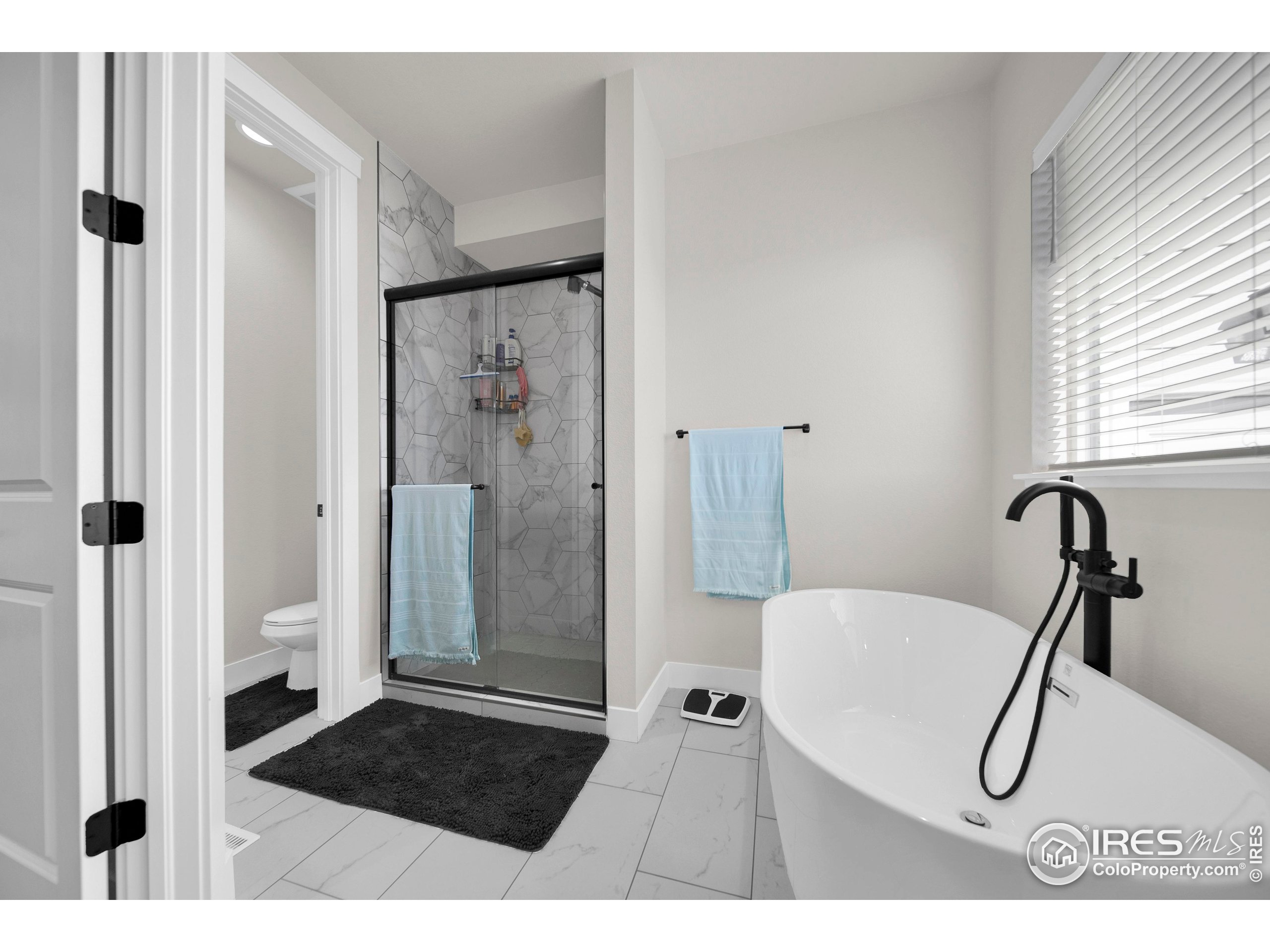 116 7th Avenue Wiggins, CO 80654 - Photo 23 of 42 a bathroom with a shower