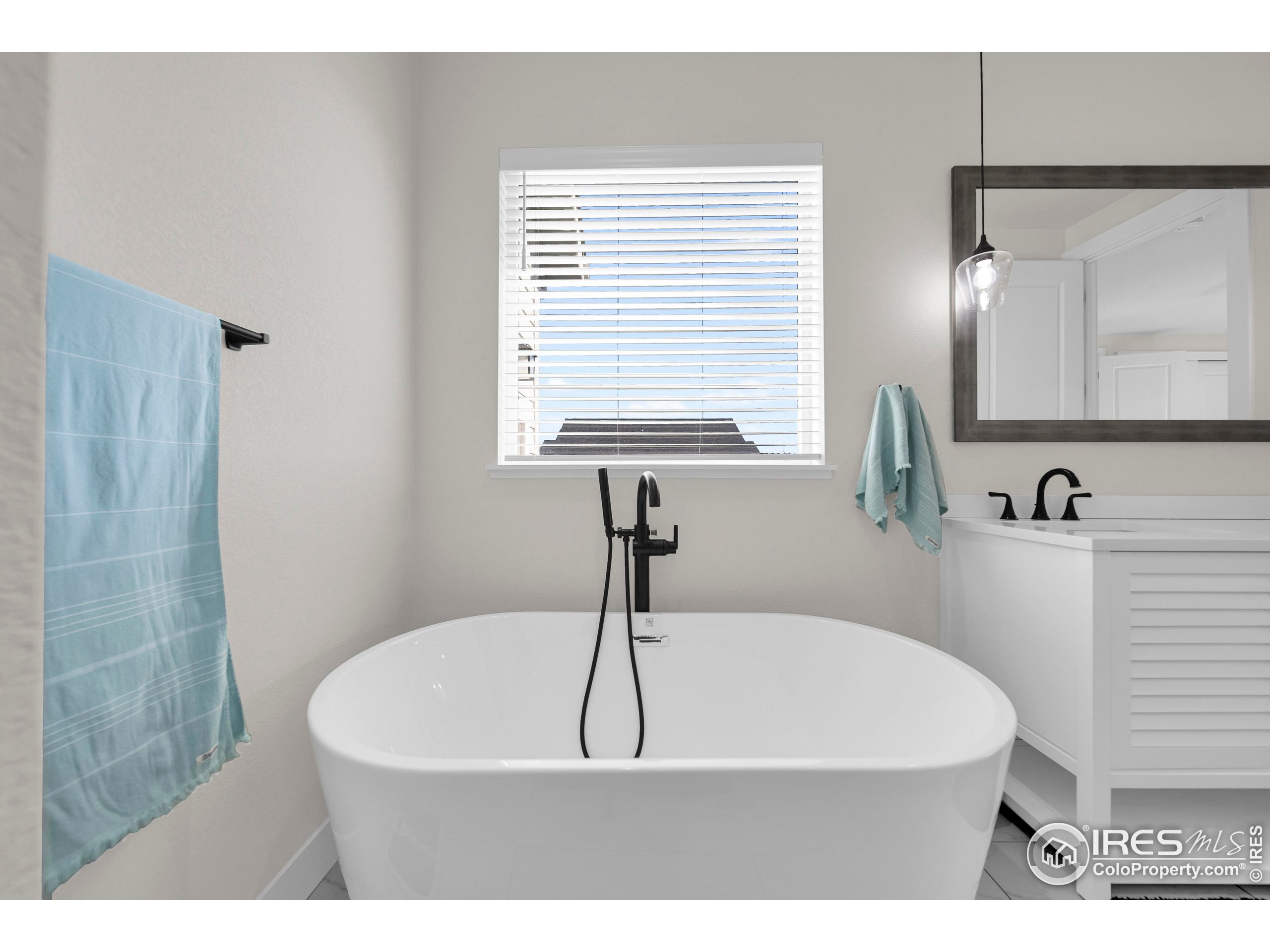 116 7th Avenue Wiggins, CO 80654 - Photo 24 of 42 a picture of a bathroom sink