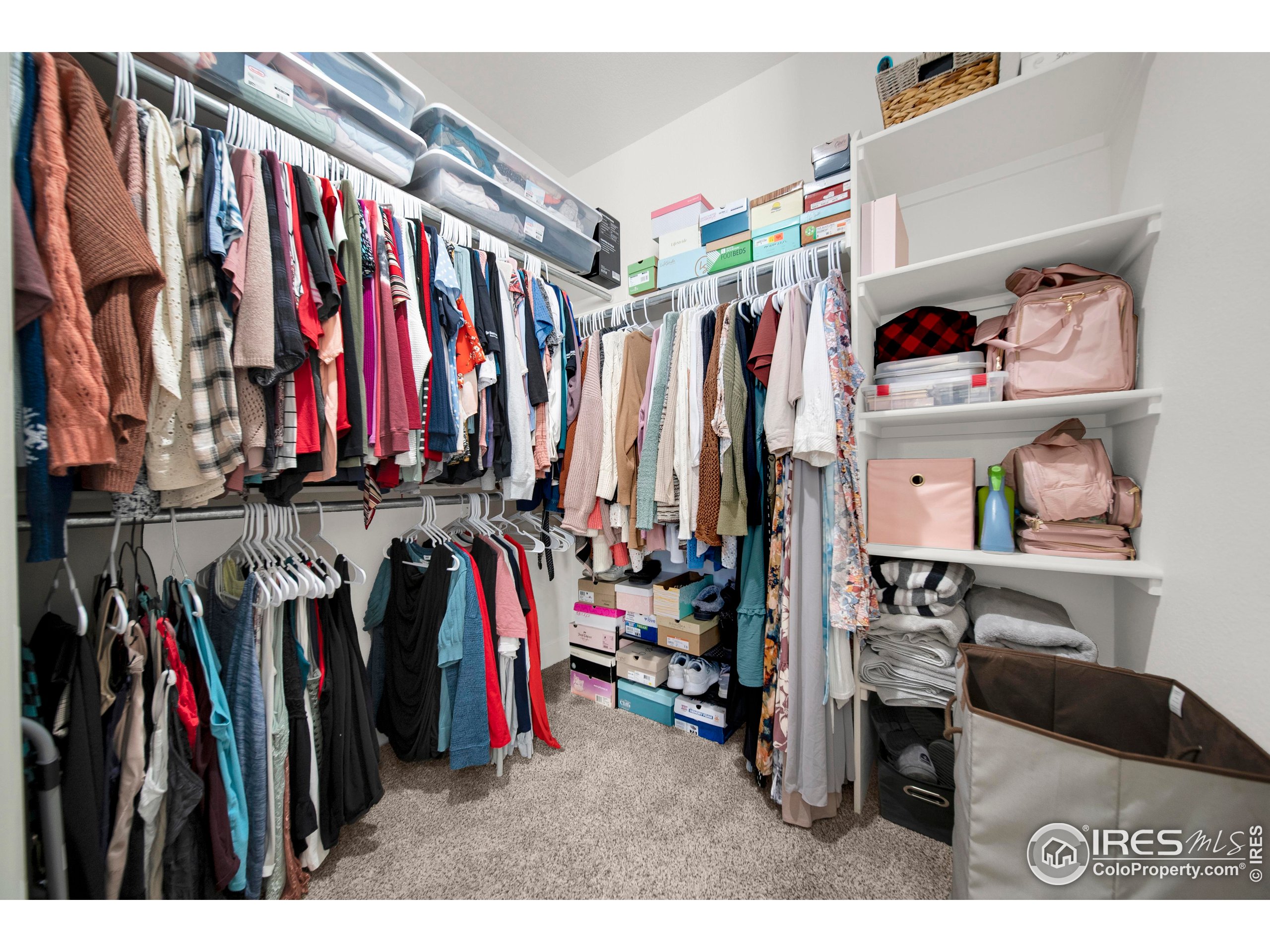 116 7th Avenue Wiggins, CO 80654 - Photo 25 of 42 a view of walk in closet with clothes