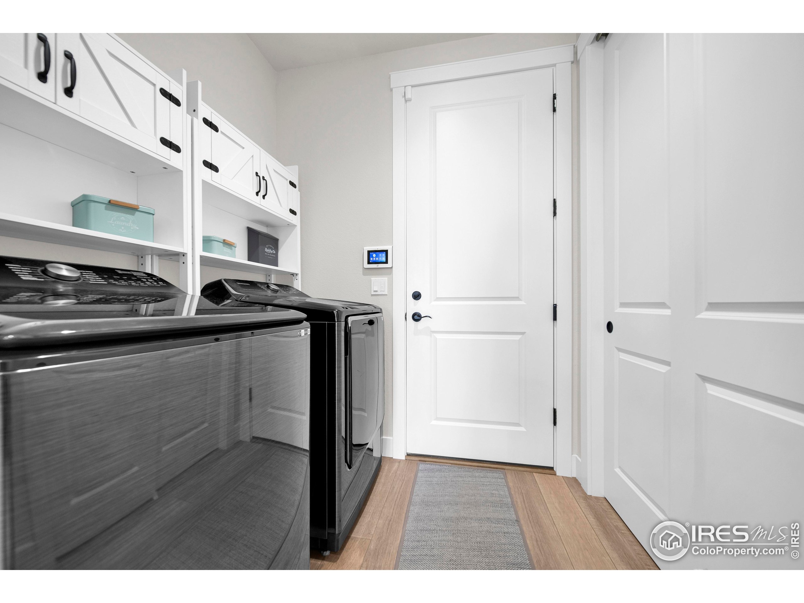 116 7th Avenue Wiggins, CO 80654 - Photo 29 of 42 a kitchen with stainless steel appliances a sink and a refrigerator