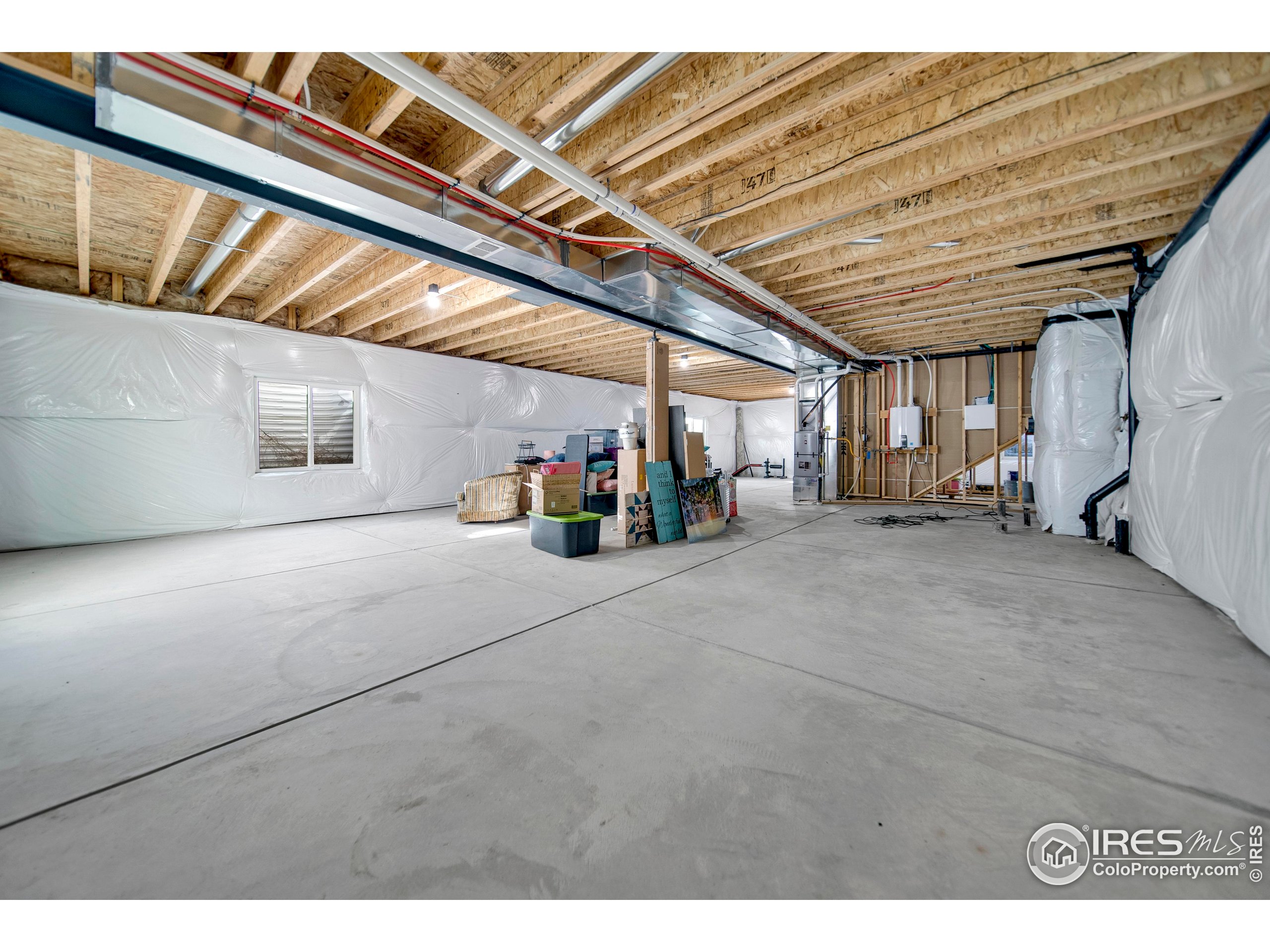 116 7th Avenue Wiggins, CO 80654 - Photo 30 of 42 a view of storage and utility room