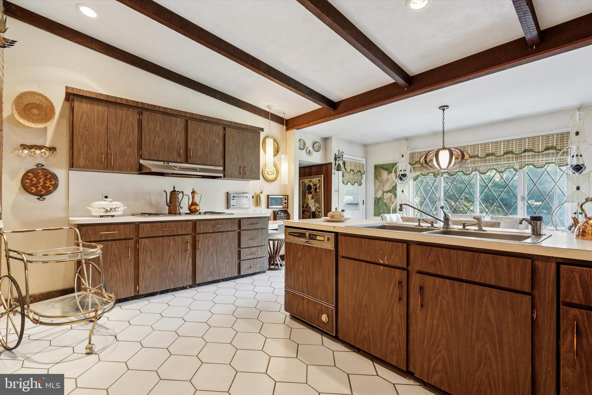 341 Cedar Road Elkins Park, PA 19027 - Photo 11 of 59 a kitchen with a sink and cabinets