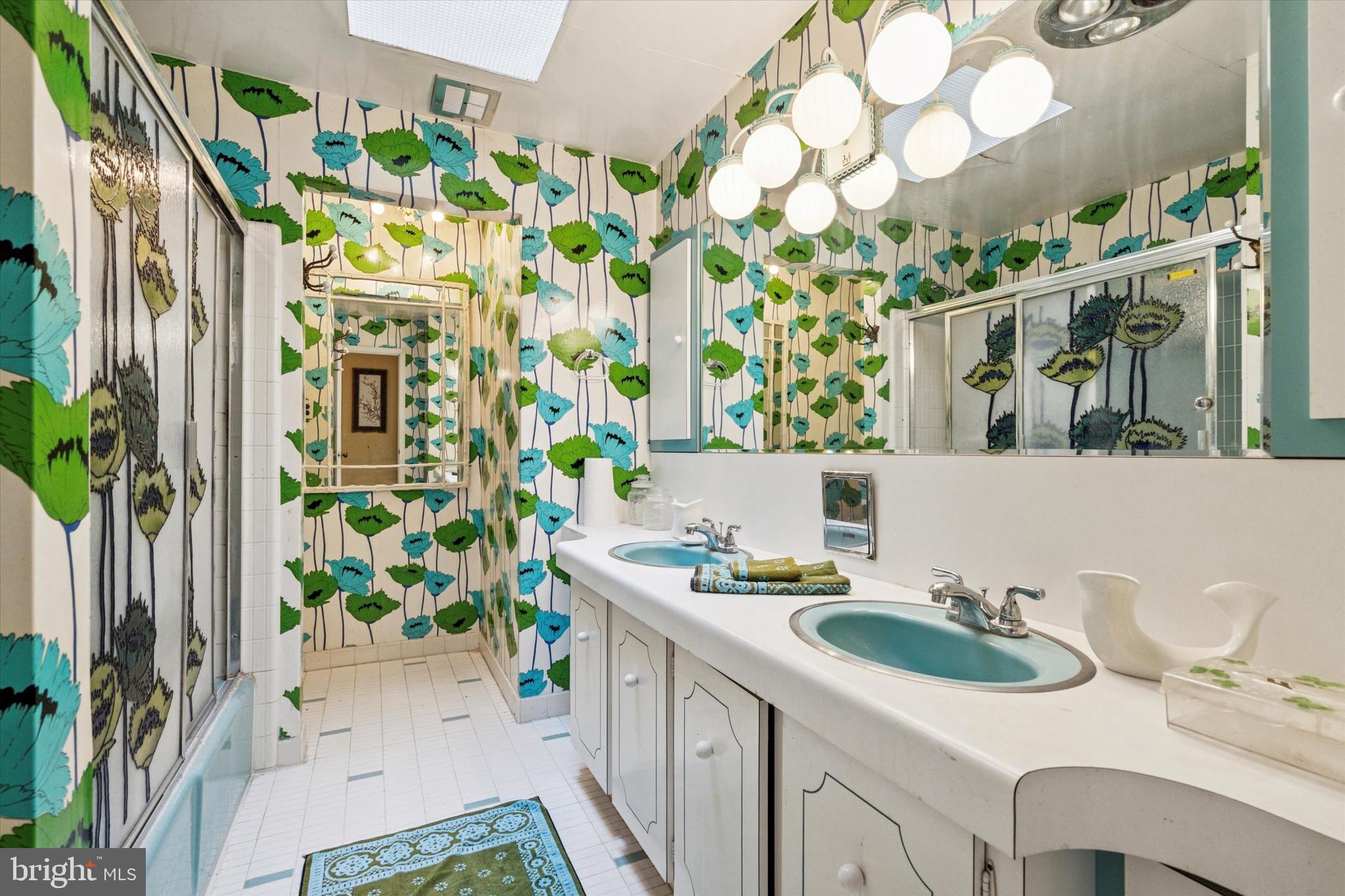 341 Cedar Road Elkins Park, PA 19027 - Photo 31 of 59 a bathroom with a sink a mirror and a shower curtain