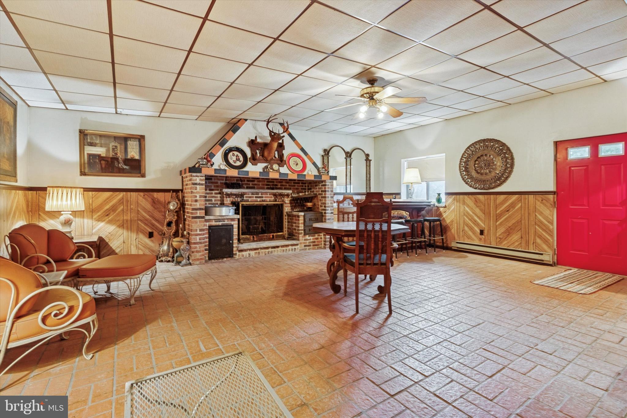 341 Cedar Road Elkins Park, PA 19027 - Photo 49 of 59 a living room with furniture a clock and a clock on wall