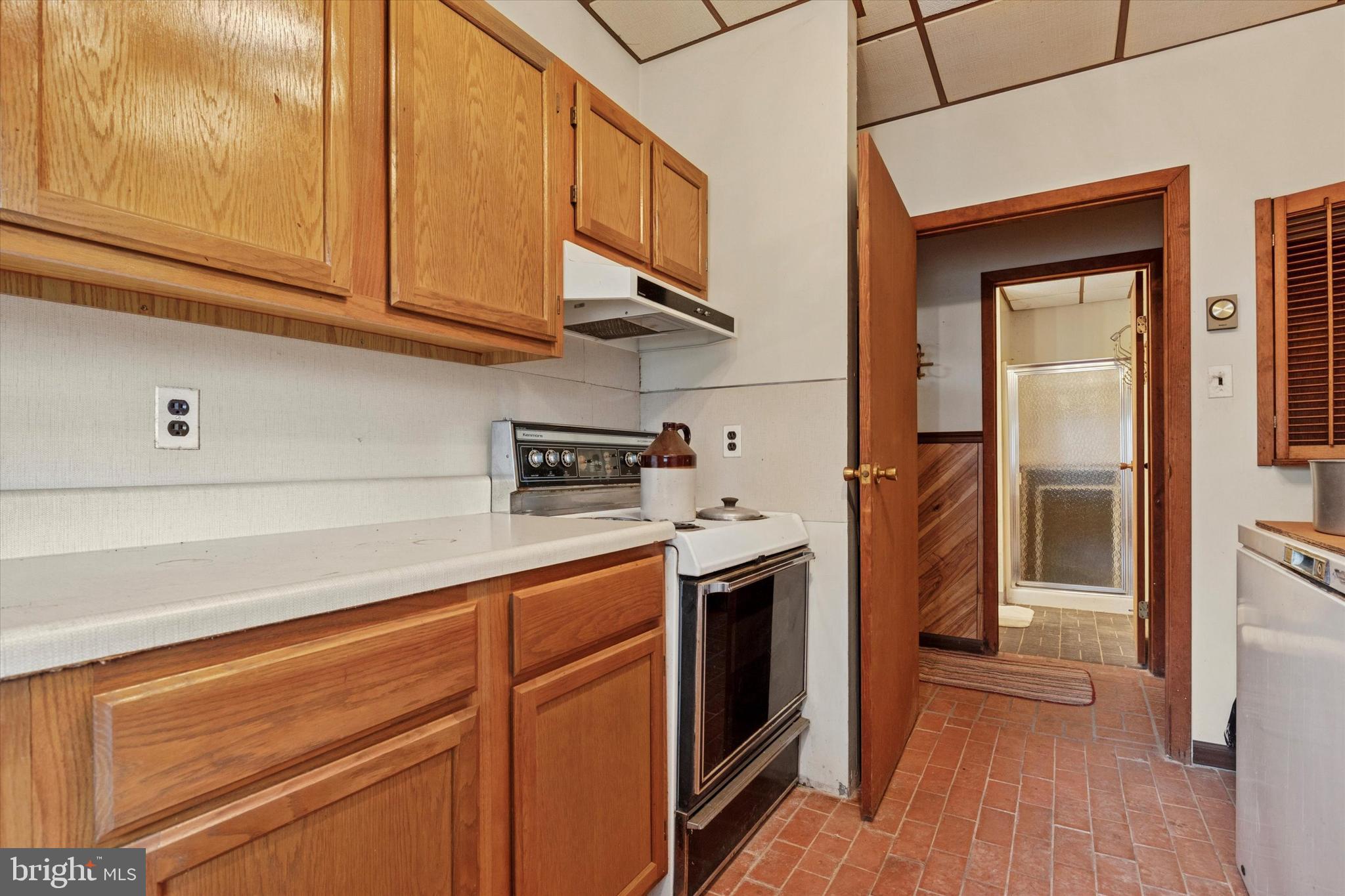 341 Cedar Road Elkins Park, PA 19027 - Photo 54 of 59 a kitchen with stainless steel appliances granite countertop a refrigerator and a stove top oven