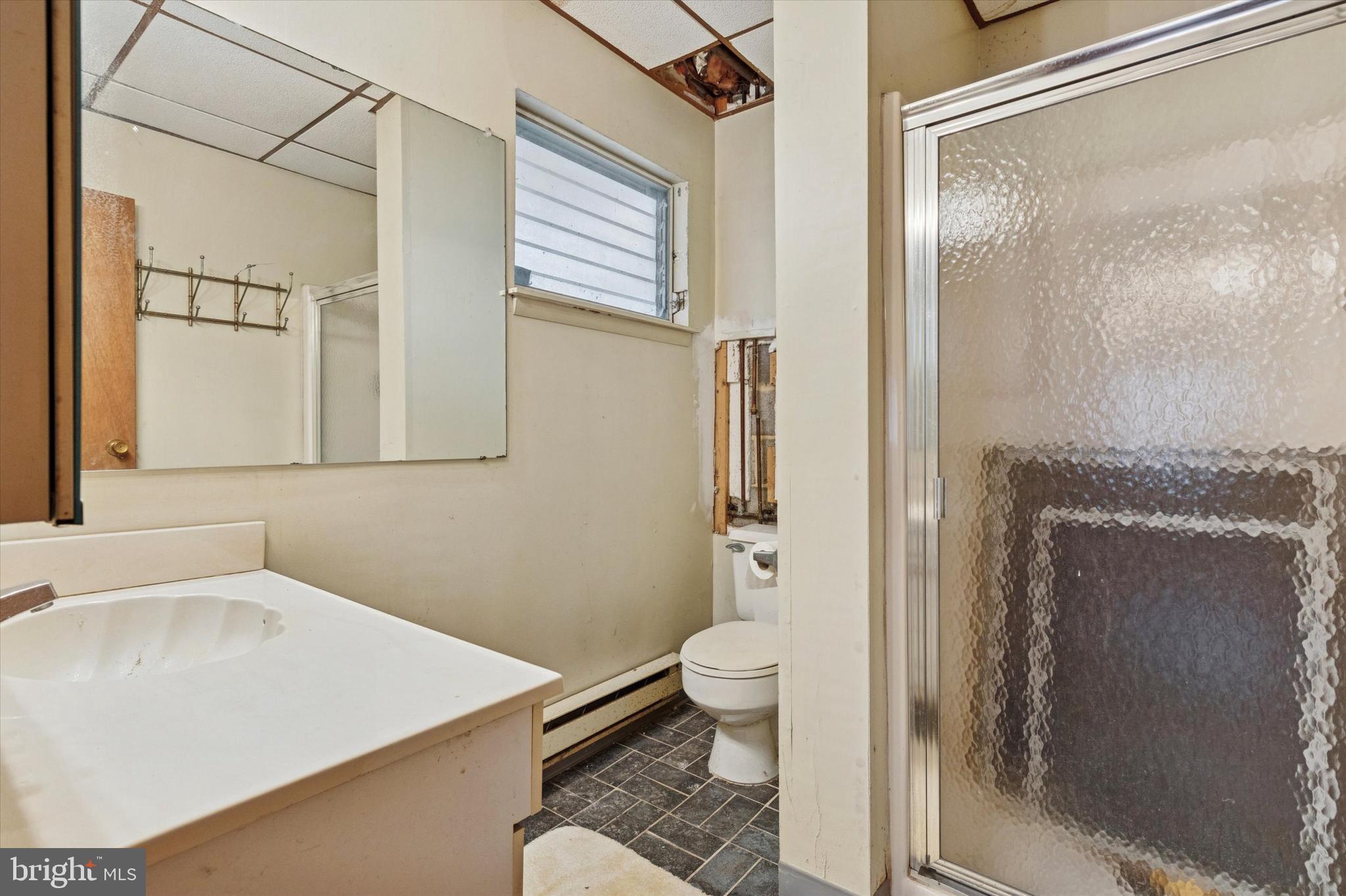 341 Cedar Road Elkins Park, PA 19027 - Photo 55 of 59 a bathroom with a sink toilet and shower