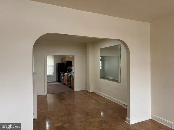 a view of a hallway with wooden shelves