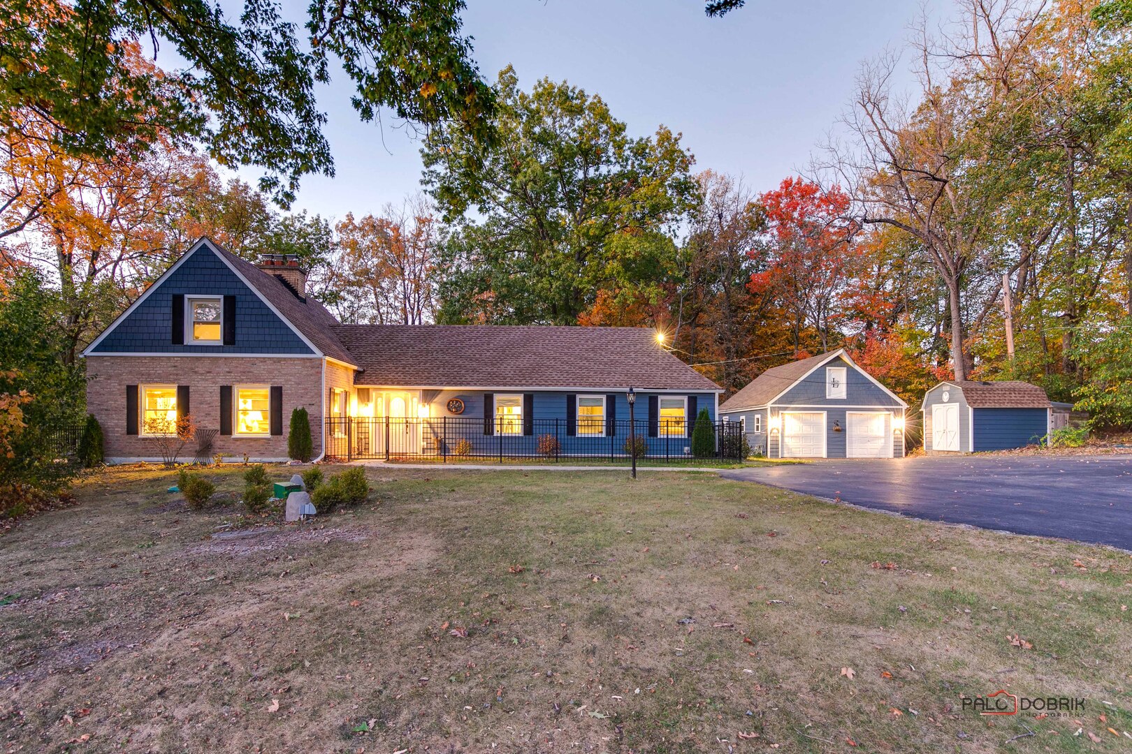 3386 Old McHenry Road Long Grove, IL 60047 - Photo 1 of 48 a front view of a house with a yard and garage