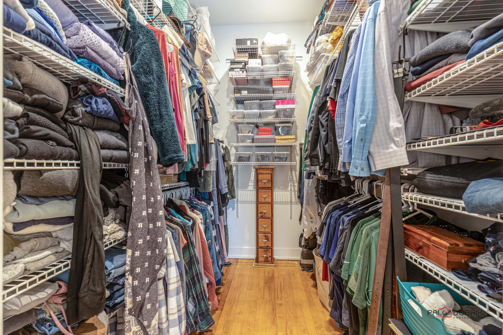 3386 Old McHenry Road Long Grove, IL 60047 - Photo 13 of 48 a view of walk in closet with clothes and shoes