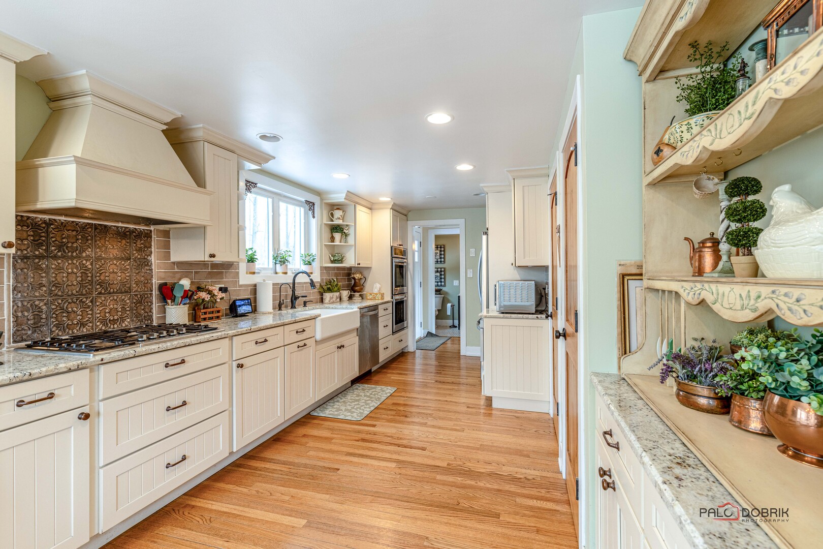 3386 Old McHenry Road Long Grove, IL 60047 - Photo 8 of 48 a large kitchen with stainless steel appliances kitchen island granite countertop a lot of counter space and wooden floor