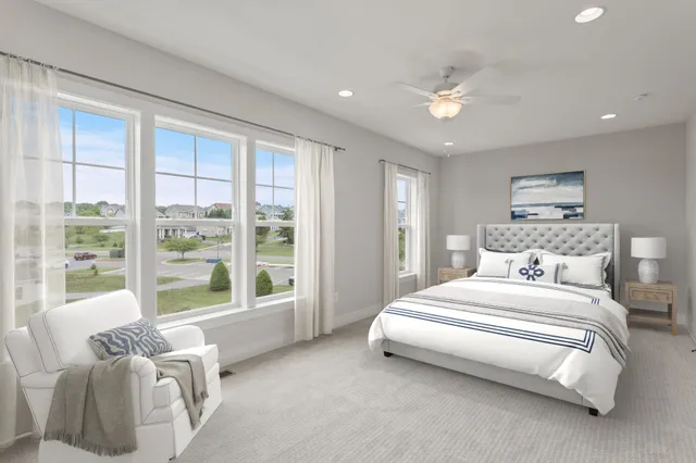 an empty room with a window and a ceiling fan