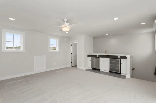 a view of a terrace with couches and city view