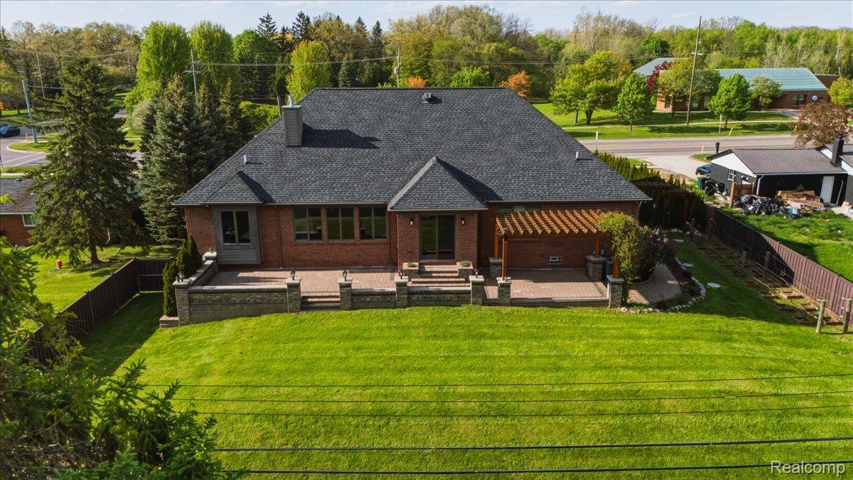 35339 West 13 Mile Road Farmington, MI 48331 - Photo 51 of 72 Rear view of property featuring a fenced backyard, a patio area, and brick siding