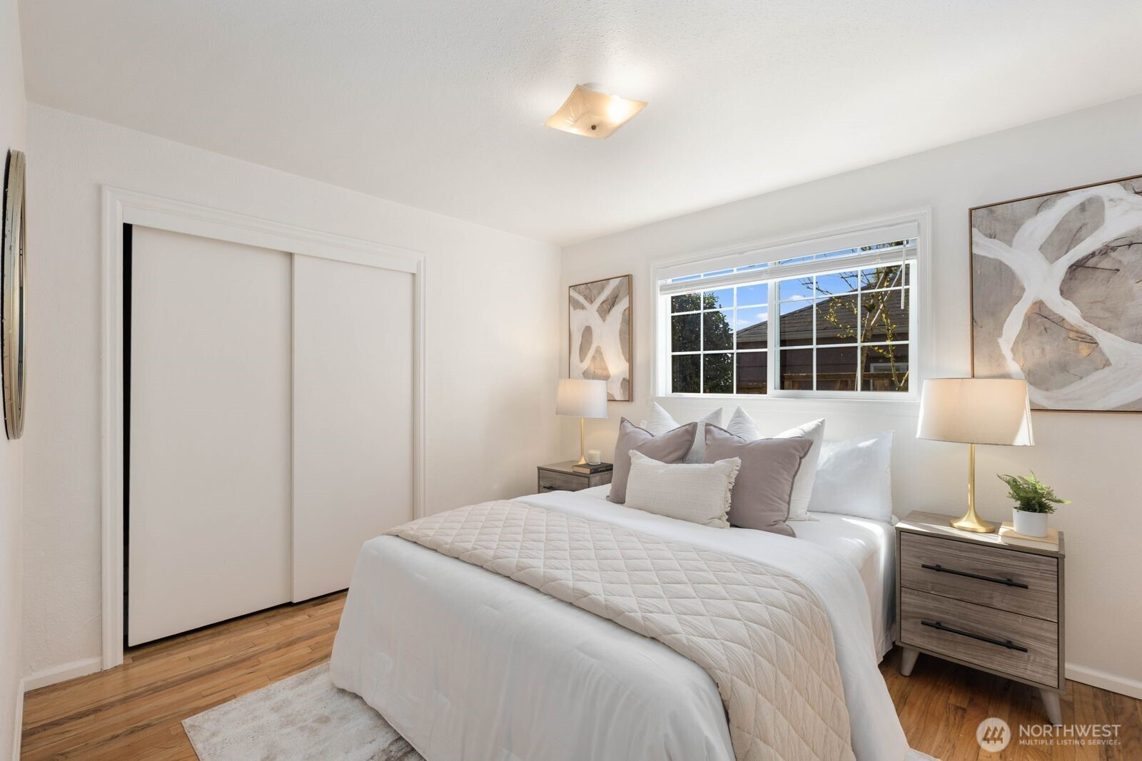 7508 30th Avenue Southwest Seattle, WA 98126 - Photo 18 of 39 a bedroom with a bed and a window