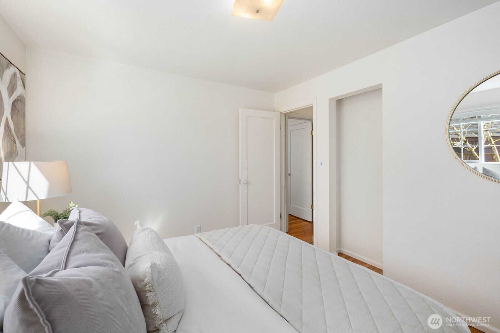 7508 30th Avenue Southwest Seattle, WA 98126 - Photo 19 of 39 a bedroom with a bed and a window