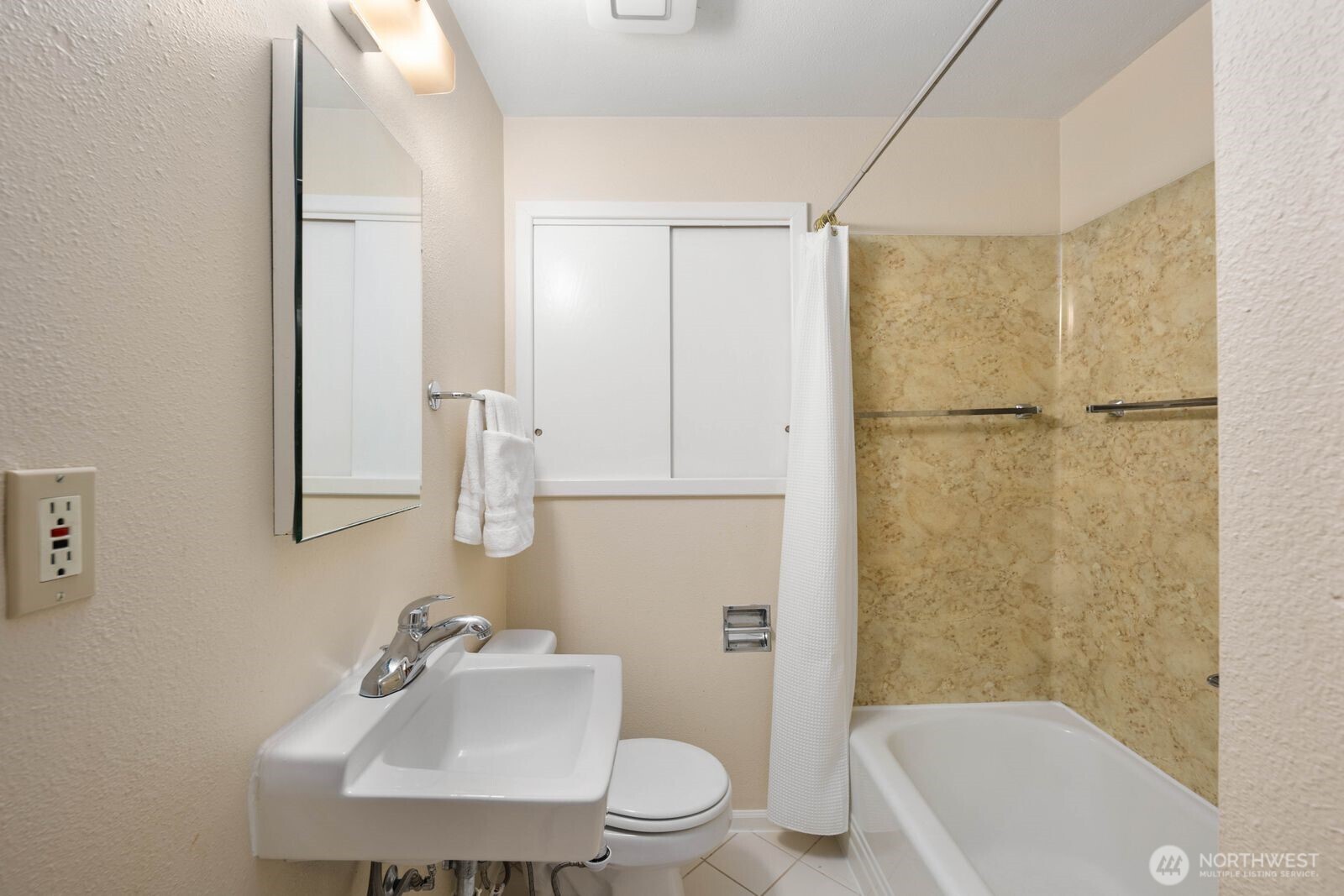 7508 30th Avenue Southwest Seattle, WA 98126 - Photo 20 of 39 a bathroom with a sink toilet and shower