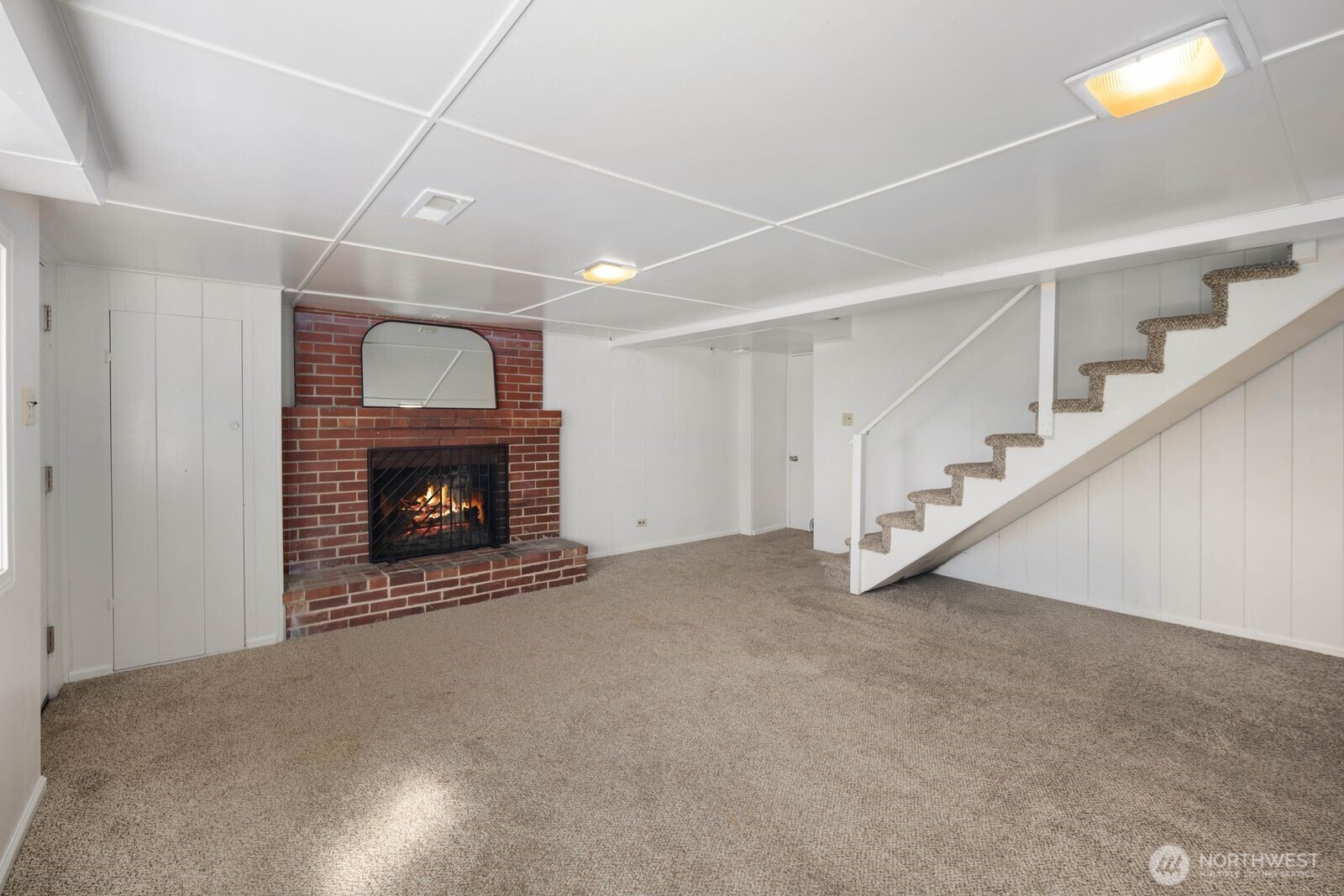 7508 30th Avenue Southwest Seattle, WA 98126 - Photo 21 of 39 a view of an empty room with a fireplace