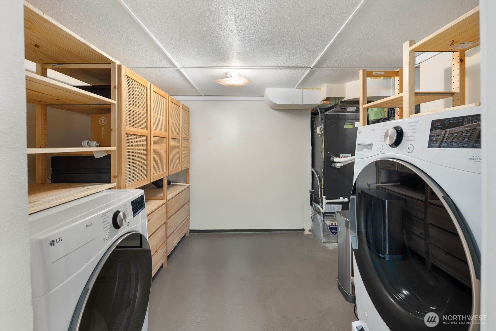 7508 30th Avenue Southwest Seattle, WA 98126 - Photo 26 of 39 a view of a storage & utility room with washer and dryer