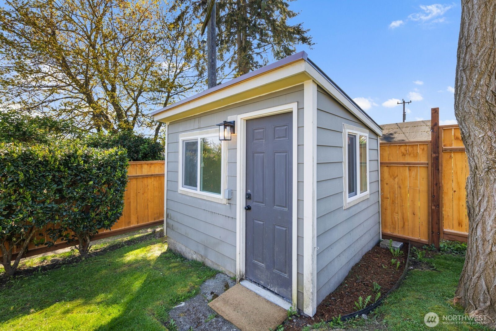 7508 30th Avenue Southwest Seattle, WA 98126 - Photo 27 of 39 a view of a house with backyard