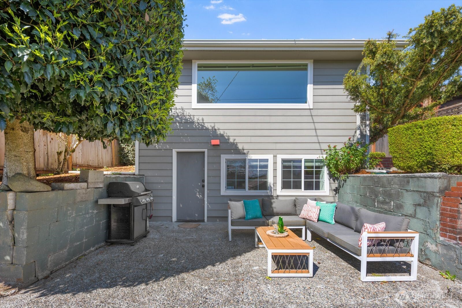 7508 30th Avenue Southwest Seattle, WA 98126 - Photo 30 of 39 a backyard of a house with seating space