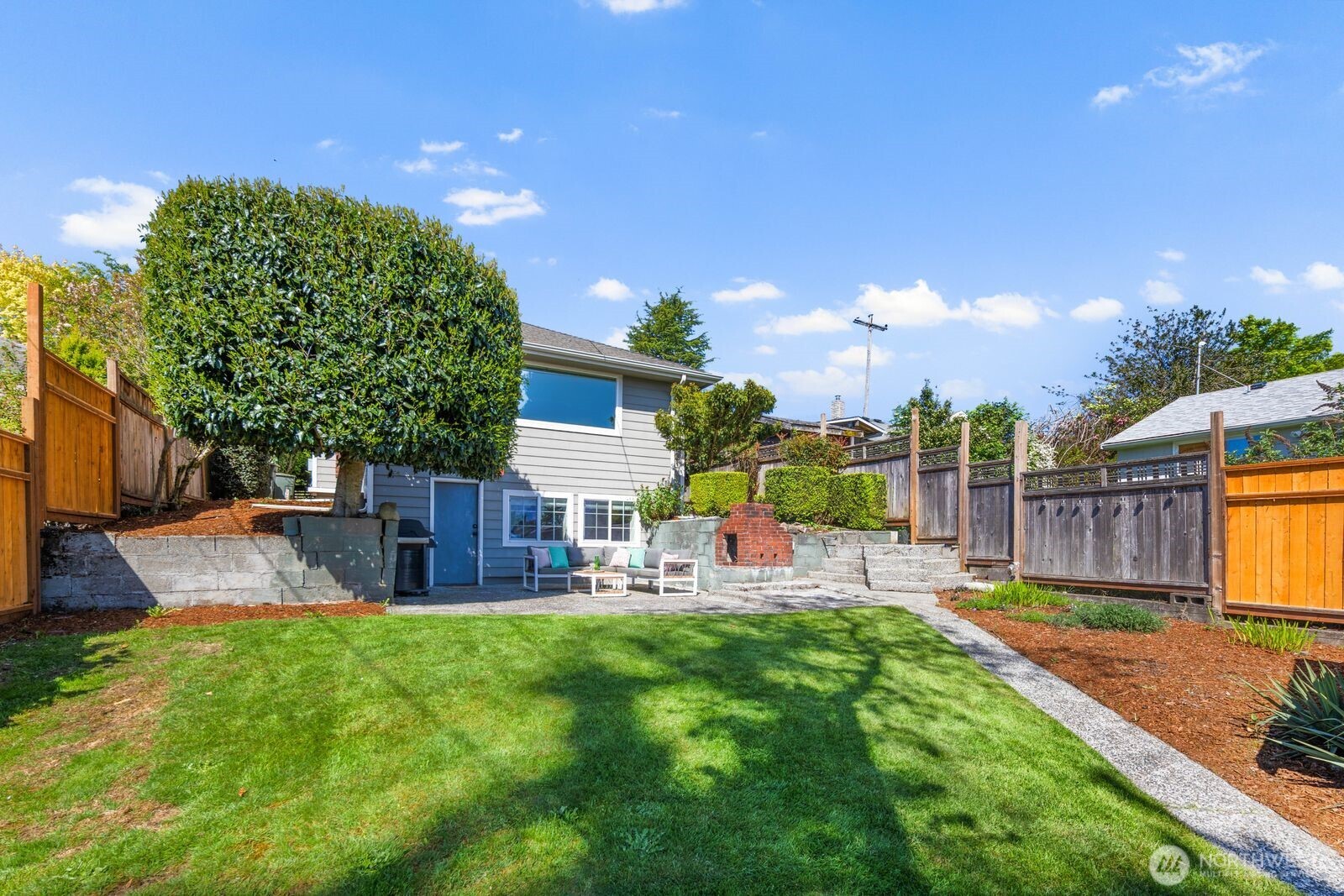 7508 30th Avenue Southwest Seattle, WA 98126 - Photo 34 of 39 a view of a house with backyard and sitting area