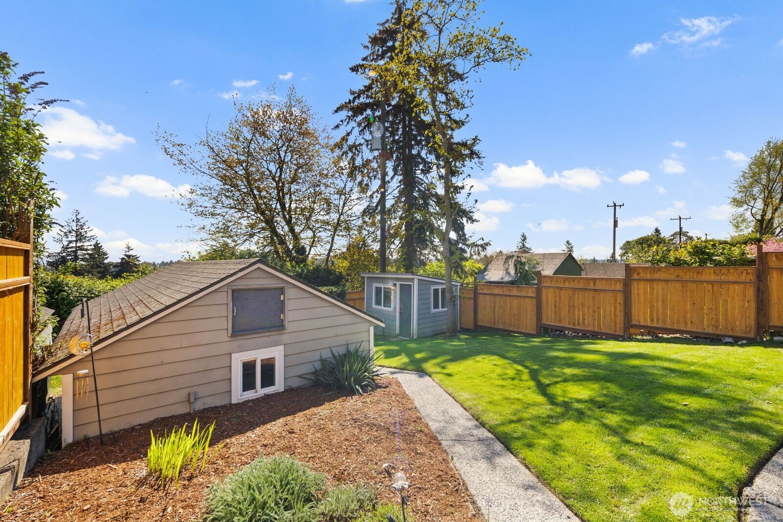 7508 30th Avenue Southwest Seattle, WA 98126 - Photo 35 of 39 a view of a backyard with a garden