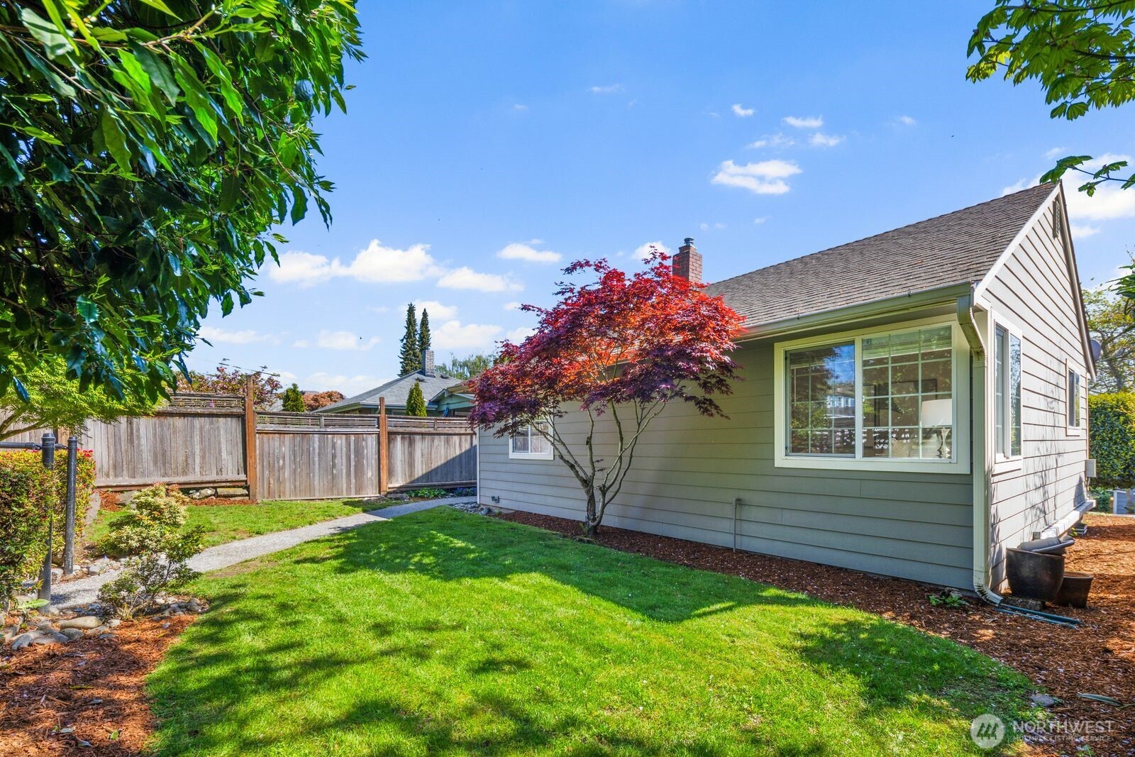 7508 30th Avenue Southwest Seattle, WA 98126 - Photo 39 of 39 a view of a house with a yard