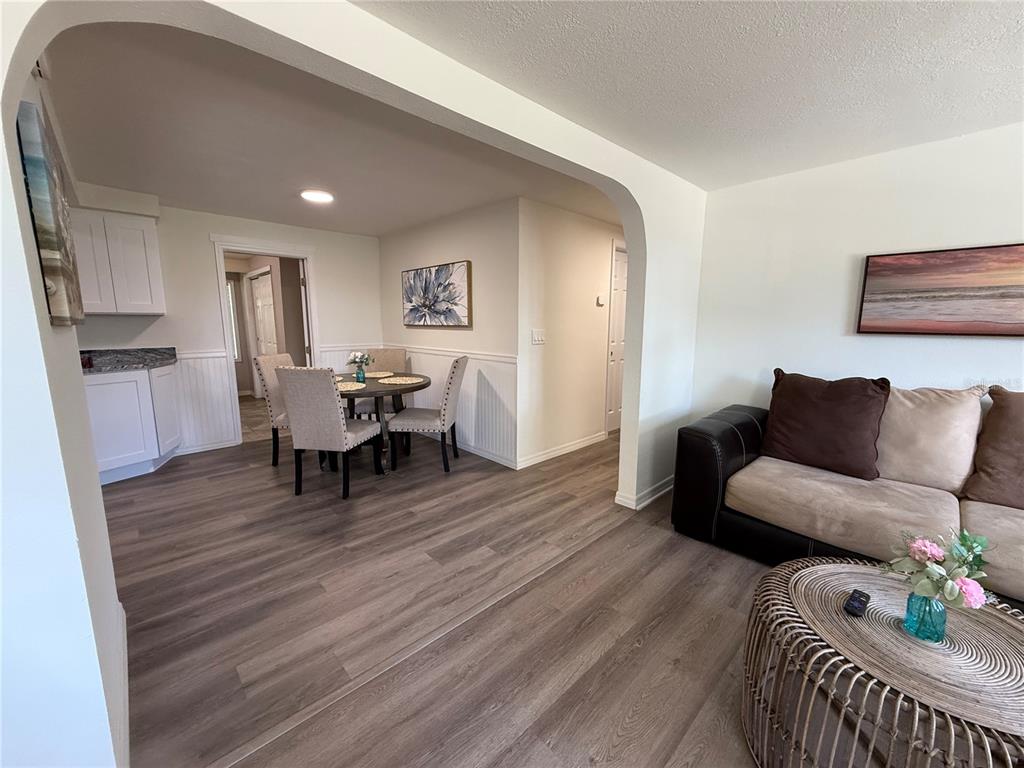 3625 Windham Drive Holiday, FL 34691 - Photo 12 of 28 a living room with furniture and a wooden floor