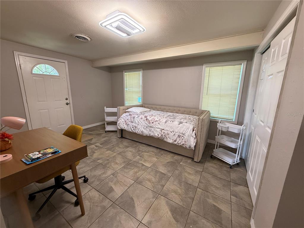 3625 Windham Drive Holiday, FL 34691 - Photo 15 of 28 a bedroom with a bed and a window