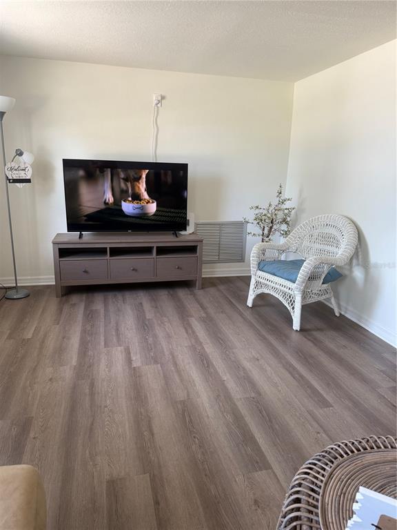 3625 Windham Drive Holiday, FL 34691 - Photo 20 of 28 a living room with furniture and a wooden floor