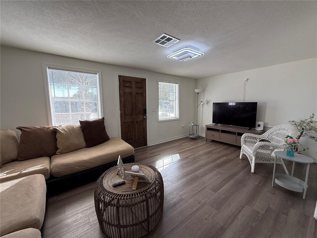 3625 Windham Drive Holiday, FL 34691 - Photo 28 of 28 a living room with furniture and a flat screen tv