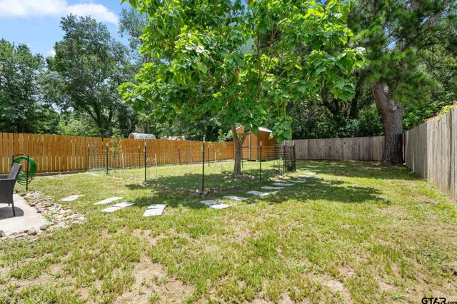 a view of a yard with a slide
