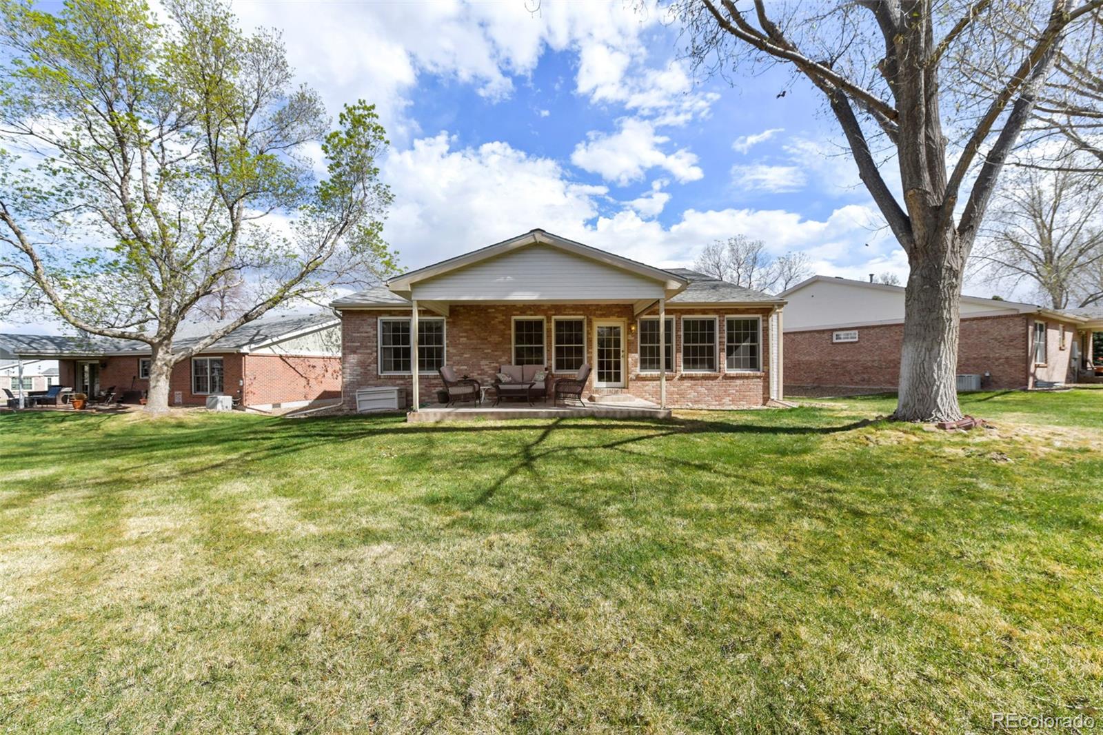 4823 Greenwich Place Highlands Ranch, CO 80130 - Photo 26 of 28 a view of a house with a yard