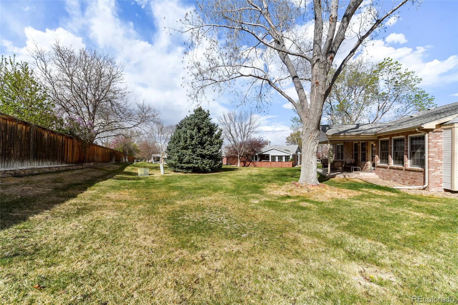 4823 Greenwich Place Highlands Ranch, CO 80130 - Photo 28 of 28 a view of a house with a yard