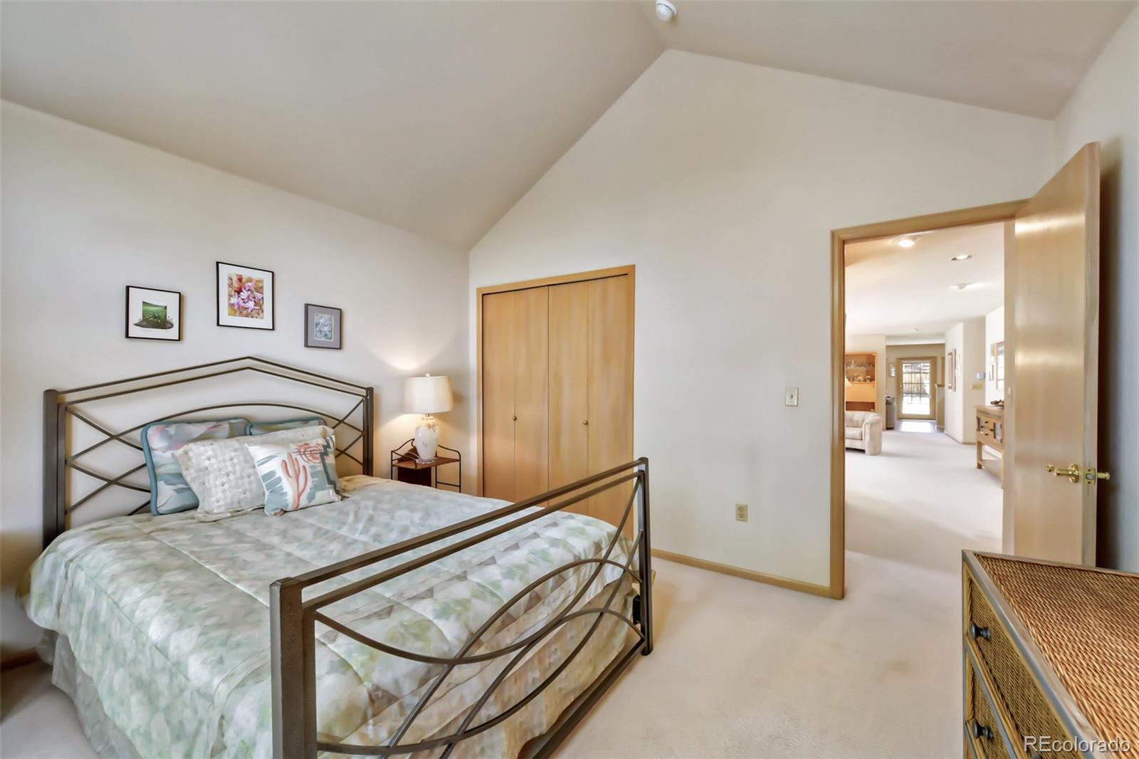 4823 Greenwich Place Highlands Ranch, CO 80130 - Photo 6 of 28 a bedroom with a bed and wooden floor