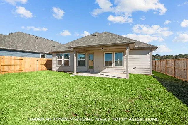a view of a house with a backyard