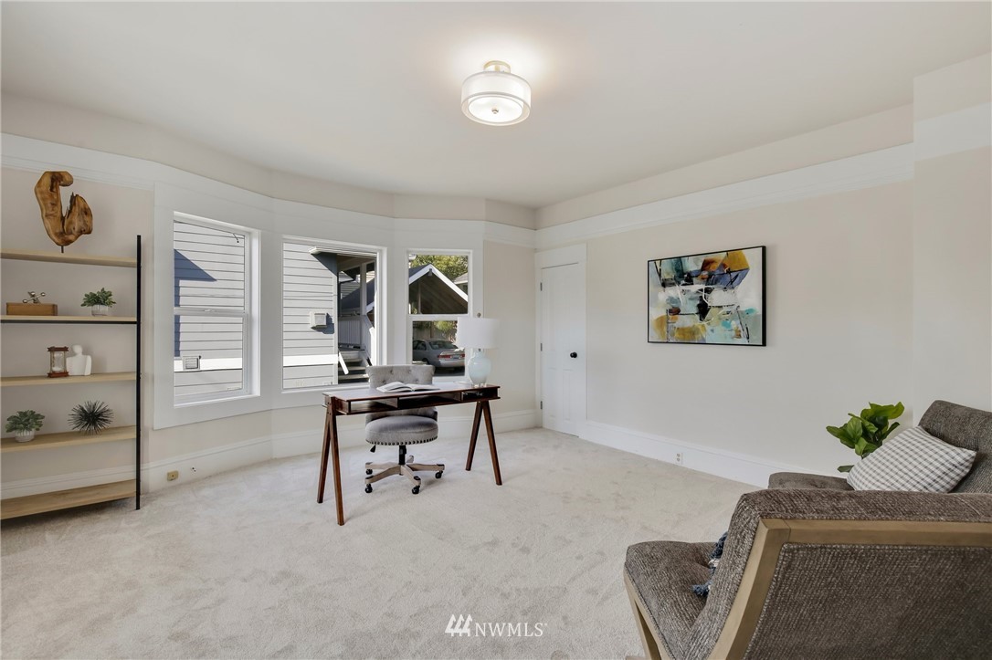 162 18th Avenue Seattle, WA 98122 - Photo 13 of 38 a living room with furniture and a window