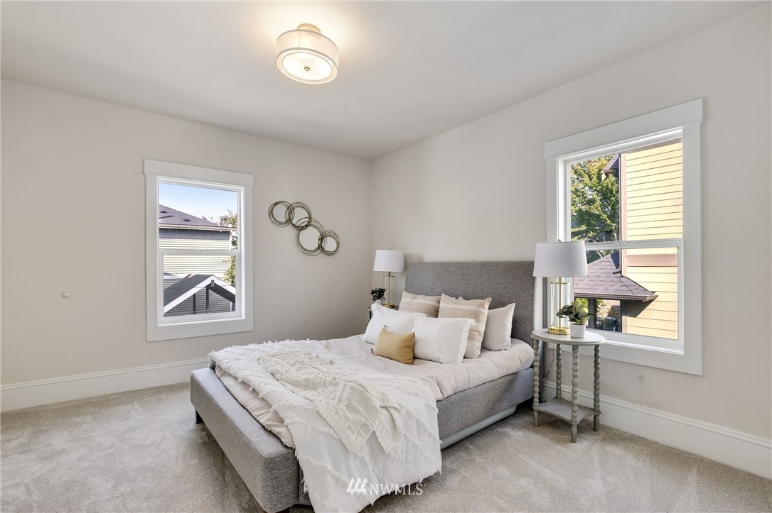 162 18th Avenue Seattle, WA 98122 - Photo 16 of 38 a bedroom with a bed and a window