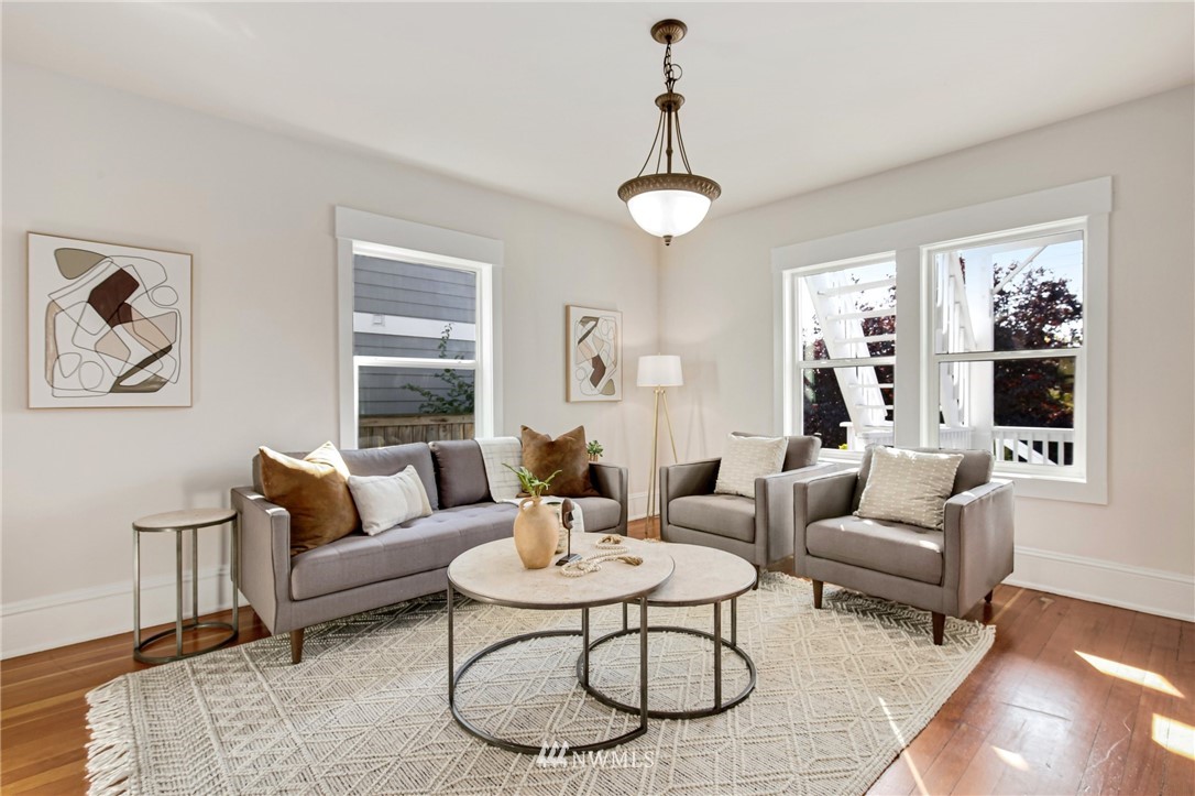 162 18th Avenue Seattle, WA 98122 - Photo 4 of 38 a living room with furniture a rug and a large window