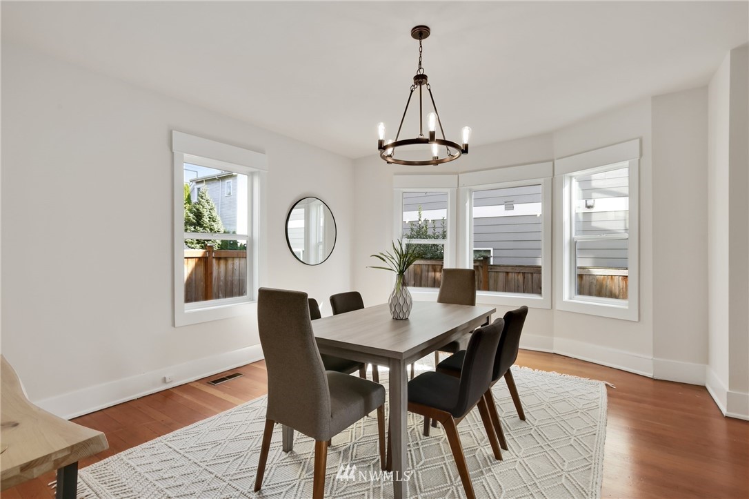 162 18th Avenue Seattle, WA 98122 - Photo 7 of 38 a view of a dining room with furniture window and wooden floor