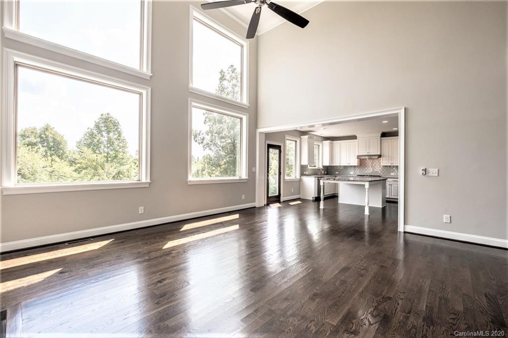 133 Overlook Ridge Lane Davidson, NC 28036 - Photo 14 of 35 a view of empty room with wooden floor and windows