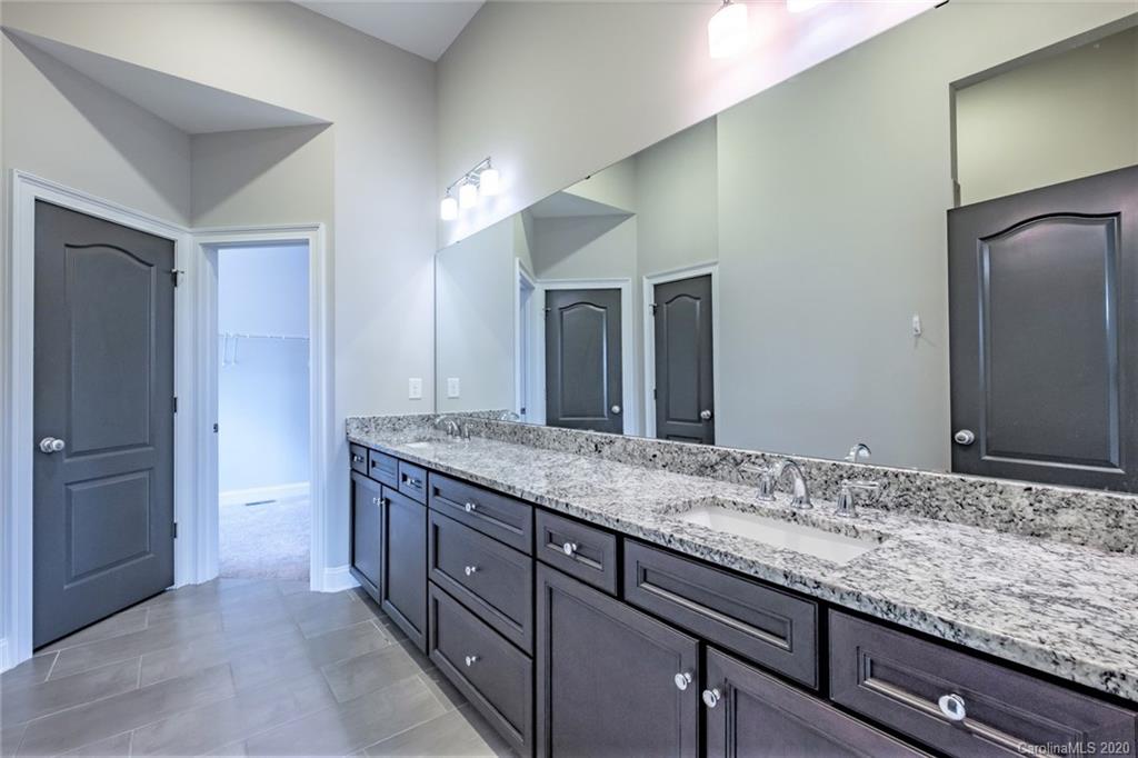 133 Overlook Ridge Lane Davidson, NC 28036 - Photo 17 of 35 a bathroom with a granite countertop sink and a mirror
