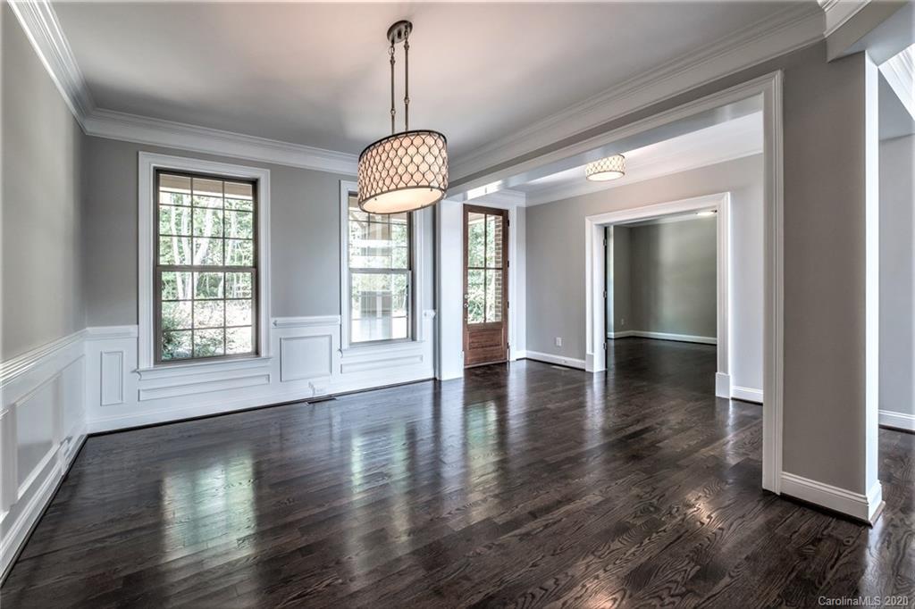 133 Overlook Ridge Lane Davidson, NC 28036 - Photo 3 of 35 a view of a livingroom with wooden floor and a chandelier