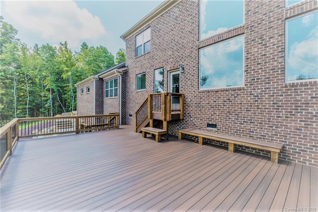133 Overlook Ridge Lane Davidson, NC 28036 - Photo 22 of 35 a view of a deck with chairs and wooden floor