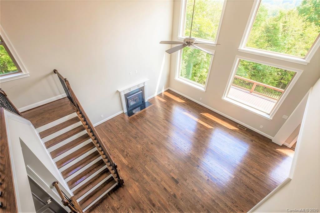 133 Overlook Ridge Lane Davidson, NC 28036 - Photo 27 of 35 a view of an empty room with wooden floor and windows