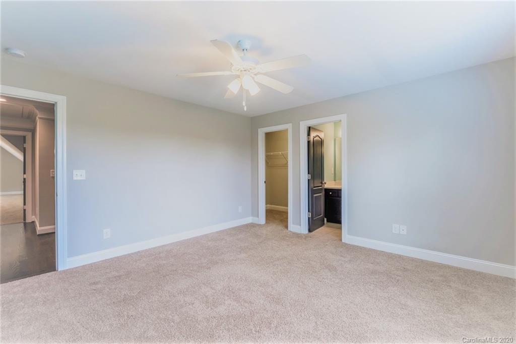 133 Overlook Ridge Lane Davidson, NC 28036 - Photo 28 of 35 a view of an empty room with a ceiling fan